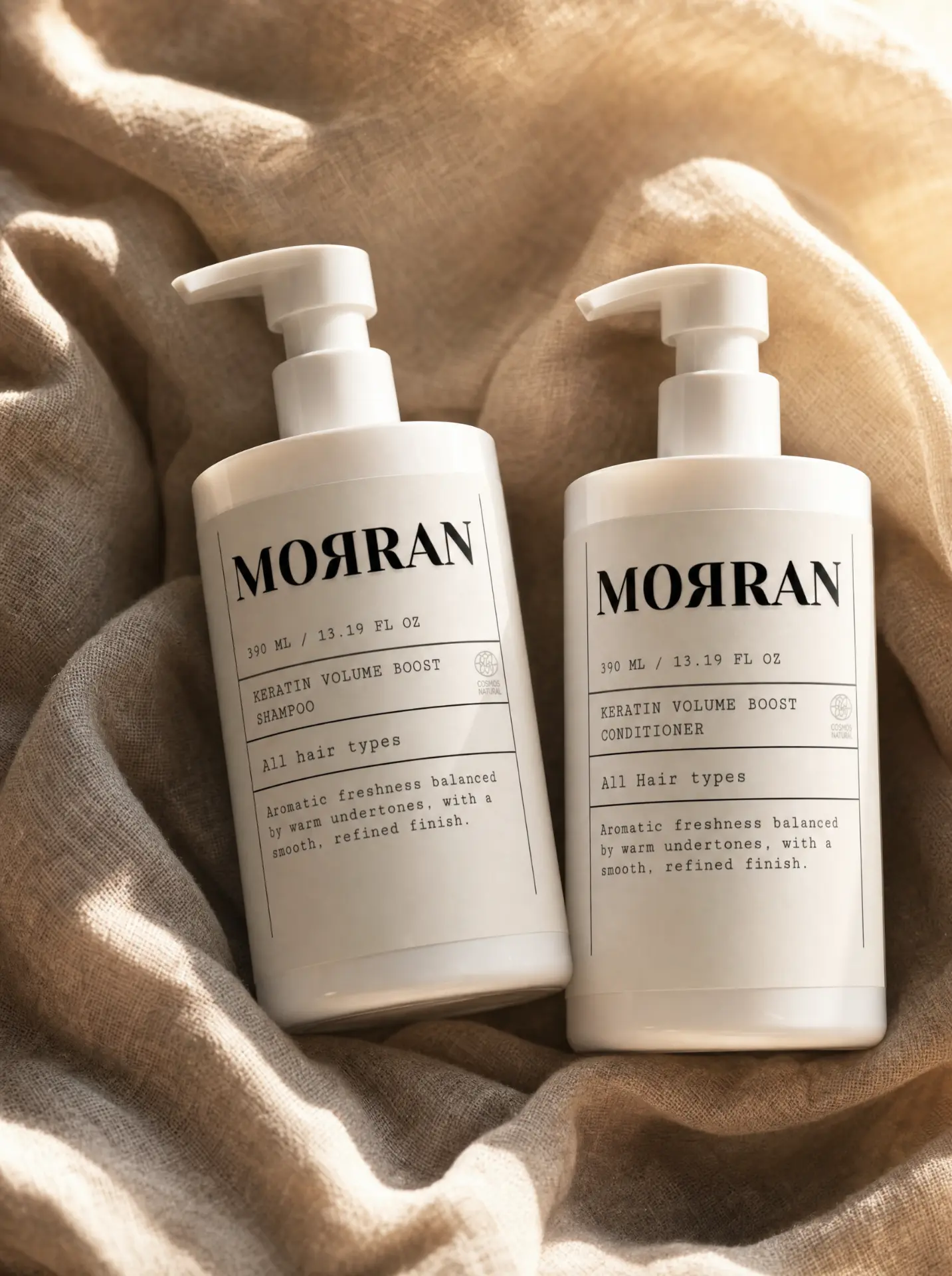Morran Keratin Volume Boost shampoo and conditioner on draped linen in warm sunlight
